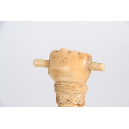 460 - A 19th CENTURY SCRIMSHAW WHALE BONE WALKING CANE having a clenched fist marine ivory handle above in... 