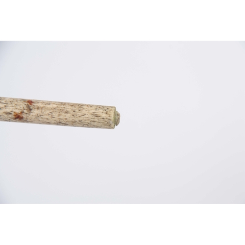 460 - A 19th CENTURY SCRIMSHAW WHALE BONE WALKING CANE having a clenched fist marine ivory handle above in... 