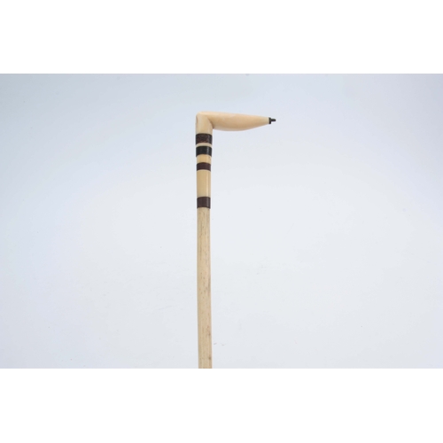 464 - A 19TH CENTURY WHALE BONE WALKING STICK with Baline bands and shaped handle 74cm overall.