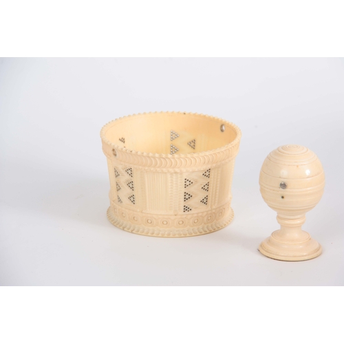 489 - A 19th CENTURY TURNED IVORY BASKET with pierced and engine turned decoration 9.5cm diameter, togethe... 