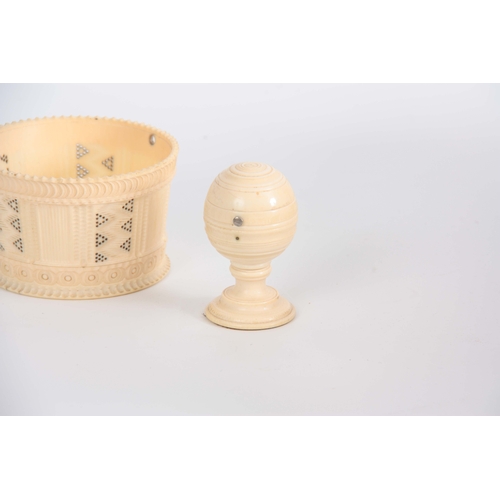 489 - A 19th CENTURY TURNED IVORY BASKET with pierced and engine turned decoration 9.5cm diameter, togethe... 