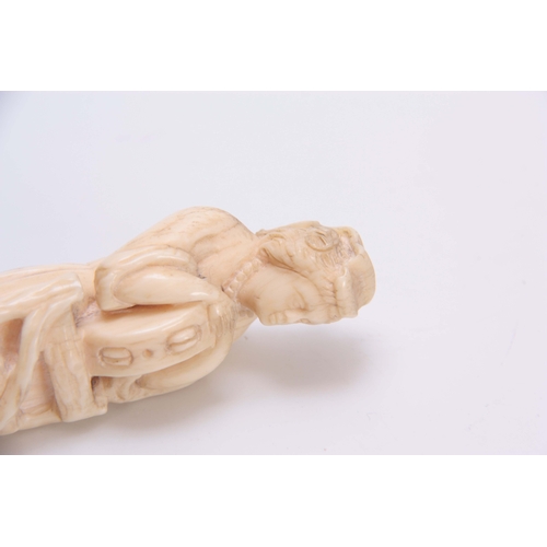 492 - A WELL PATINATED 19TH CENTURY CARVED IVORY FIGURE with brass push on fitting 12cm long