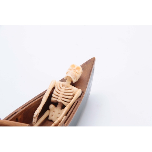 493 - AN UNUSUAL EARLY 20th CENTURY MODEL ROWING BOAT WITH IVORY SKELETON 24cm long