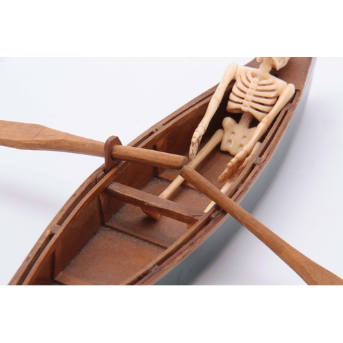 493 - AN UNUSUAL EARLY 20th CENTURY MODEL ROWING BOAT WITH IVORY SKELETON 24cm long