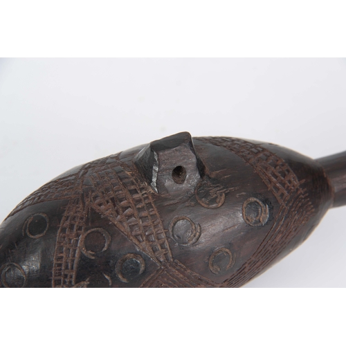 500 - A CARVED AFRICAN HARDWOOD SNUFF BOTTLE with suspension hole and carved, patterned decoration 6cm wid... 