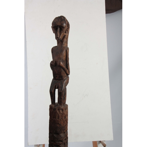 503 - AN ETHNIC AFRICAN TRIBAL MONKEY TOTEM POLE the totem carved out of a single piece of hardwood surmou... 