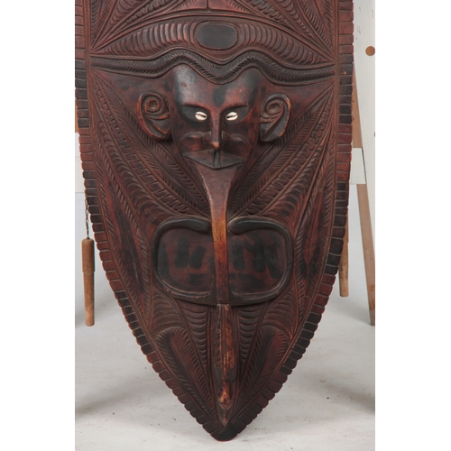 505 - A LARGE ETHNIC SEPIK RIVER TRIBAL MASK possibly from Papua New Guinea, the lower half depicting an a... 