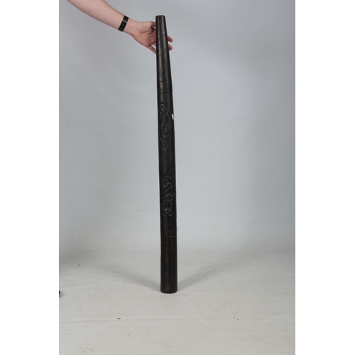 508 - A 20TH CENTURY CARVED HARDWOOD DIDGERIDOO 124cm overall.