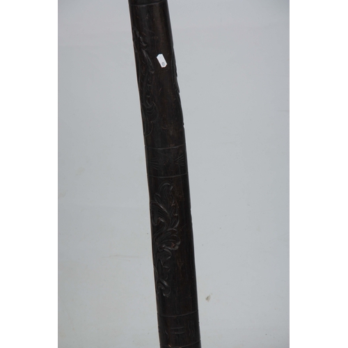 508 - A 20TH CENTURY CARVED HARDWOOD DIDGERIDOO 124cm overall.