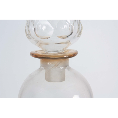 509 - A LARGE GLASS CHEMISTS WINDOW DISPLAY APOTHECARY JAR of bulbous form with faceted spire-shaped stopp... 