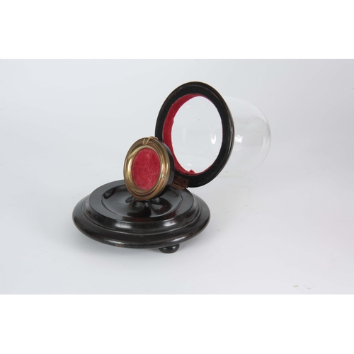 510 - A LATE 19TH CENTURY GLASS DOMED POCKET WATCH HOLDER on turned ebonised base with hinged action - 12c... 