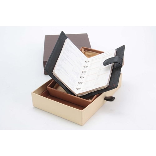 518 - A LOUIS VUITTON GRAINED BLACK LEATHER FOLDING DIARY for 2014 with sprung ring holders 14.5by18cm - w... 