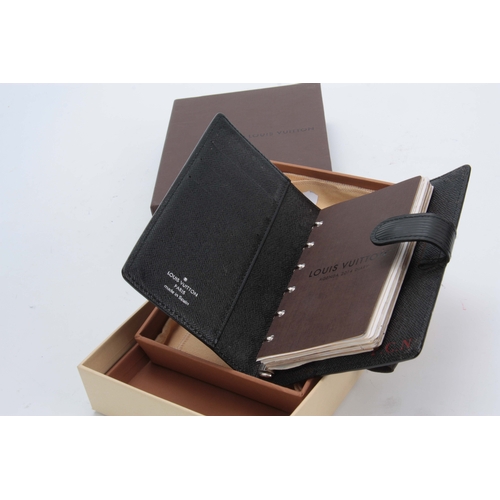 518 - A LOUIS VUITTON GRAINED BLACK LEATHER FOLDING DIARY for 2014 with sprung ring holders 14.5by18cm - w... 