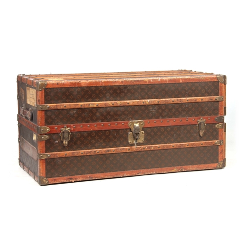 521 - A 1920'S LOUIS VUITTON MONOGRAMMED BROWN LEATHER WARDROBE TRUNK with studded slatted bindings, brass... 