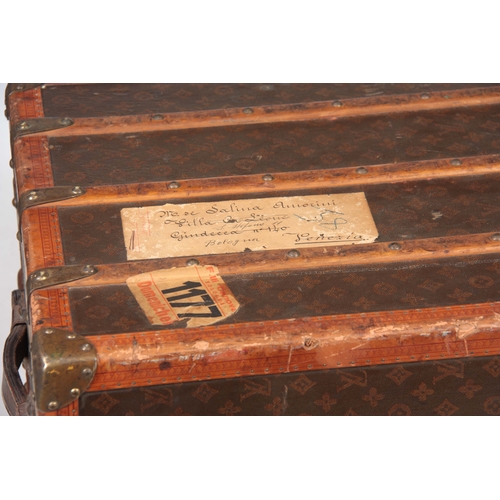 521 - A 1920'S LOUIS VUITTON MONOGRAMMED BROWN LEATHER WARDROBE TRUNK with studded slatted bindings, brass... 