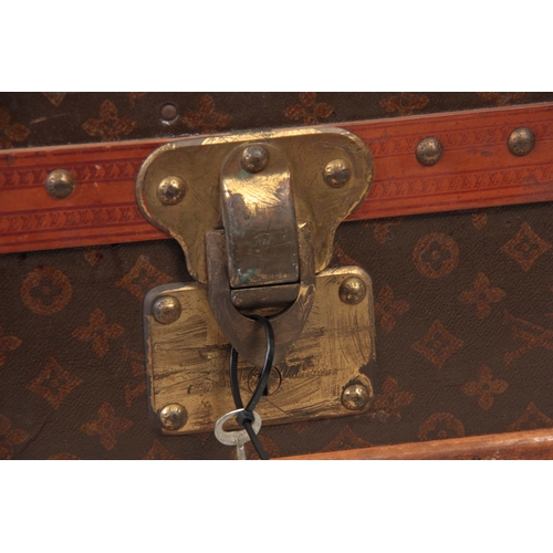 521 - A 1920'S LOUIS VUITTON MONOGRAMMED BROWN LEATHER WARDROBE TRUNK with studded slatted bindings, brass... 