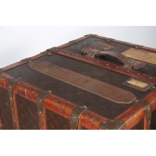 521 - A 1920'S LOUIS VUITTON MONOGRAMMED BROWN LEATHER WARDROBE TRUNK with studded slatted bindings, brass... 