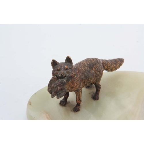 523 - AN EARLY 20th CENTURY AUSTRIAN COLD PAINTED BRONZE SCULPTURE modelled as a fox carrying a duck mount... 