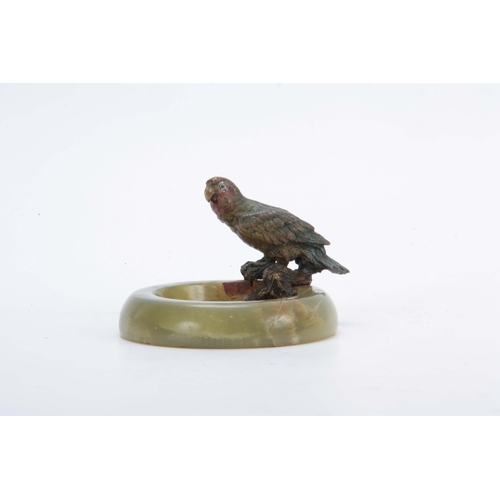 525 - A LATE 19TH CENTURY COLD PAINTED BRONZE SCULPTURE of a perched Parakatte on the rim of a circular On... 