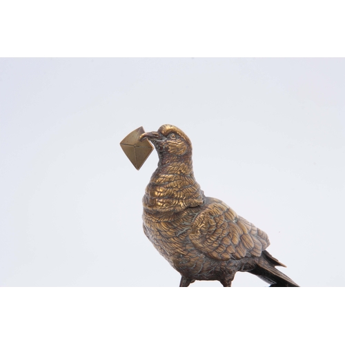 532 - A LATE 19th CENTURY AUSTRIAN BRONZE INKWELL modelled as a carrier pigeon holding an envelope in its ... 