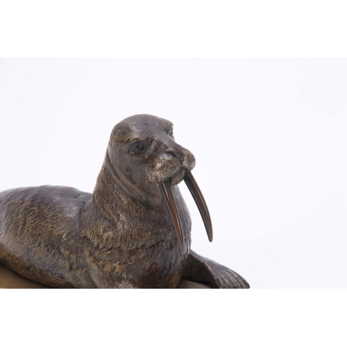 536 - A LATE 19th CENTURY AUSTRIAN COLD PAINTED BRONZE INKWELL formed as a walrus lying on a glacier style... 