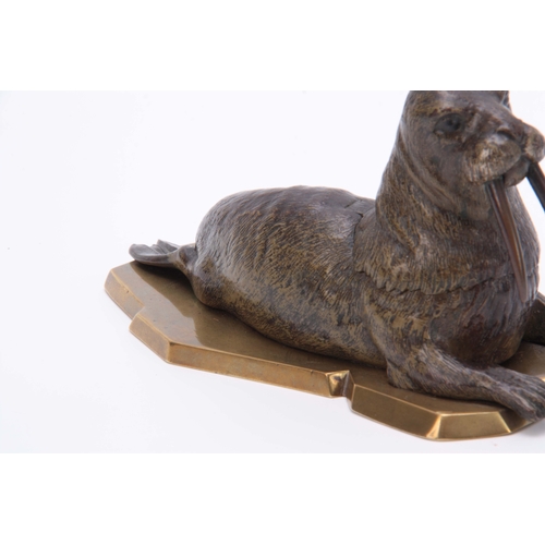 536 - A LATE 19th CENTURY AUSTRIAN COLD PAINTED BRONZE INKWELL formed as a walrus lying on a glacier style... 