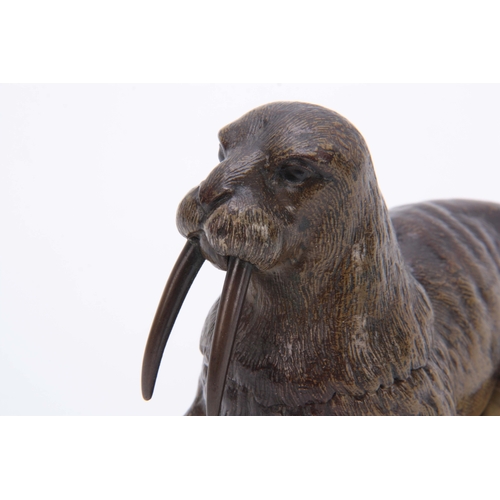 536 - A LATE 19th CENTURY AUSTRIAN COLD PAINTED BRONZE INKWELL formed as a walrus lying on a glacier style... 