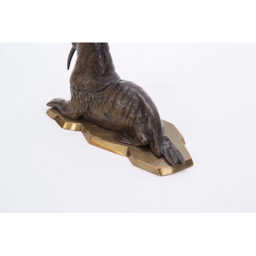 536 - A LATE 19th CENTURY AUSTRIAN COLD PAINTED BRONZE INKWELL formed as a walrus lying on a glacier style... 