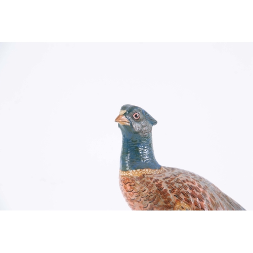 542 - A LATE 19th CENTURY PAINTED METAL SCULPTURE modelled as a pheasant 30.5cm wide