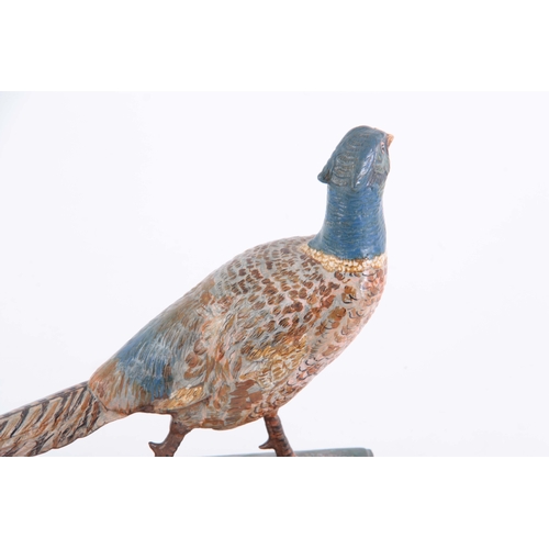 542 - A LATE 19th CENTURY PAINTED METAL SCULPTURE modelled as a pheasant 30.5cm wide