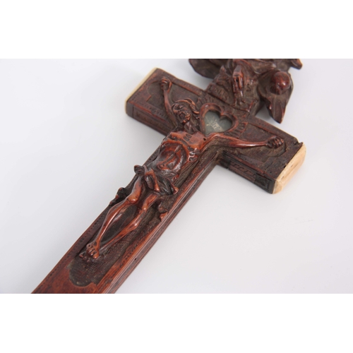 547 - A 16TH/17TH CENTURY ITALIAN FINELY CARVED WALNUT RELIQUARY CROSS WITH BONE TIPPED EDGES the high rel... 