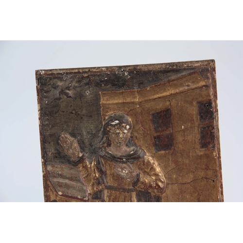 550 - AN EARLY EUROPEAN  CARVED GILT GESSO PANEL OF A SAINT 34.5cm wide 27cm high