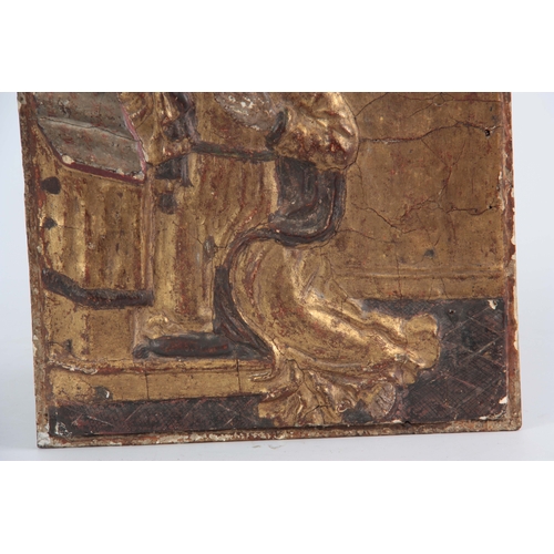 550 - AN EARLY EUROPEAN  CARVED GILT GESSO PANEL OF A SAINT 34.5cm wide 27cm high