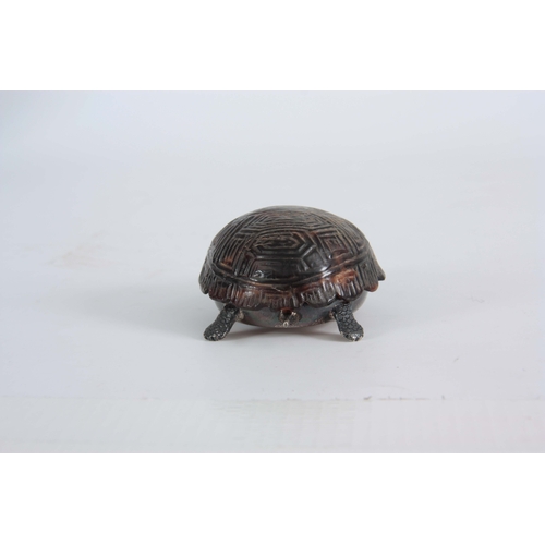 552 - A GEORGE V SILVER AND TORTOISESHELL NOVELTY DRESSING TABLE BOX  cast and modelled as a baby tortoise... 