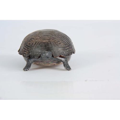 552 - A GEORGE V SILVER AND TORTOISESHELL NOVELTY DRESSING TABLE BOX  cast and modelled as a baby tortoise... 