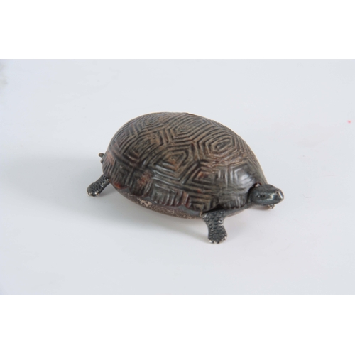 552 - A GEORGE V SILVER AND TORTOISESHELL NOVELTY DRESSING TABLE BOX  cast and modelled as a baby tortoise... 