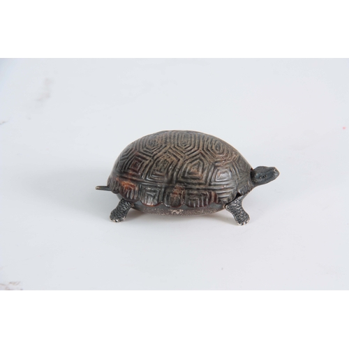 552 - A GEORGE V SILVER AND TORTOISESHELL NOVELTY DRESSING TABLE BOX  cast and modelled as a baby tortoise... 