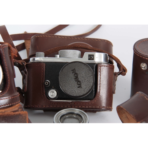 553 - A GERMAN BERNING ROBOT CAMERA with Robot Carl Zeiss lens in leather case and a Schneider Xenar lens.... 