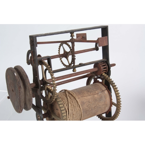 554 - AN 18TH CENTURY CLOCKWORK SPIT JACK with iron frame and wooden barrel 31cm high 35cm wide.