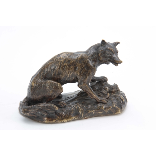 559 - A LATE 19th CENTURY PATINATED BRONZE SCULPTURE modelled as a fox with a pheasant on a naturalistic b... 