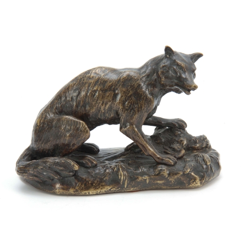 559 - A LATE 19th CENTURY PATINATED BRONZE SCULPTURE modelled as a fox with a pheasant on a naturalistic b... 