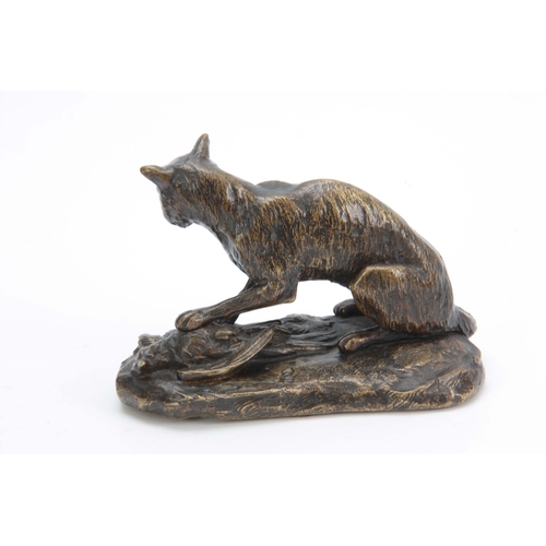 559 - A LATE 19th CENTURY PATINATED BRONZE SCULPTURE modelled as a fox with a pheasant on a naturalistic b... 