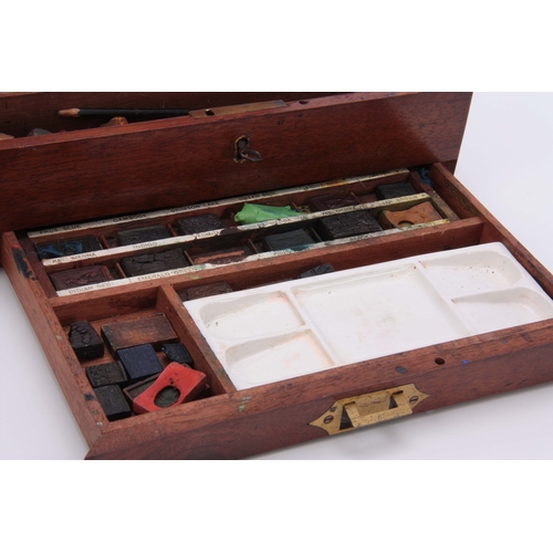 568 - A 19TH CENTURY WINSOR & NEWTON MAHOGANY ARTIST BOX with fitted interior and labelled shallow lif... 