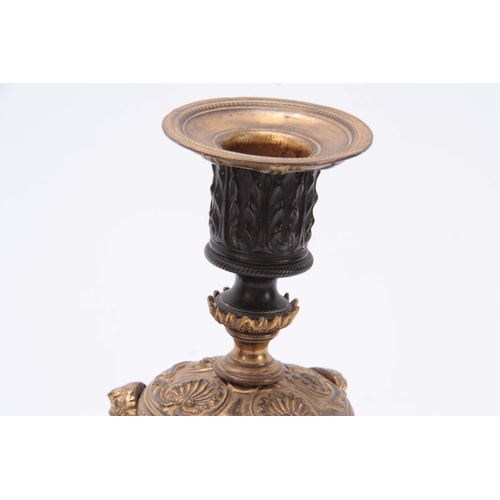 579 - A PAIR OF REGENCY BRONZE AND ORMOLU CANDLESTICKS / INCENSE BURNERS with removable scones and mask he... 