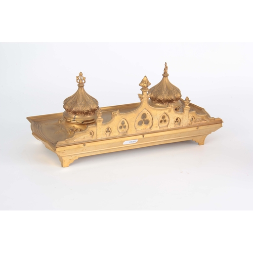 581 - A 19TH CENTURY GILT BRONZE PERSIAN STYLE INK WELL / DESK STAND with hinged Turkish domed top inkwell... 