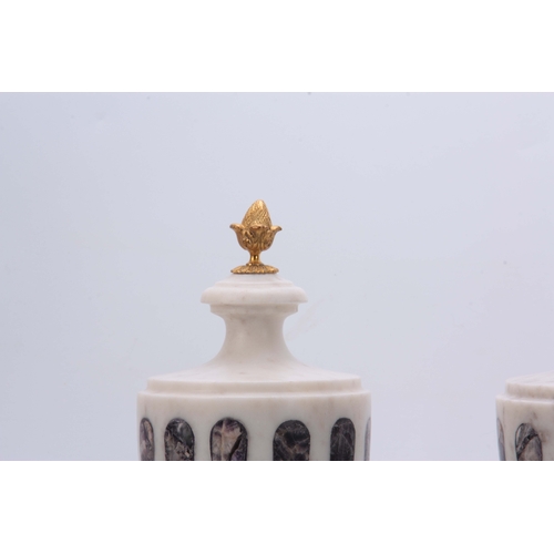 590 - A PAIR OF WHITE MARBLE AND BLUE JOHN TYPE CRYSTAL INLAID URNS with ormolu finials and swag decoratio... 