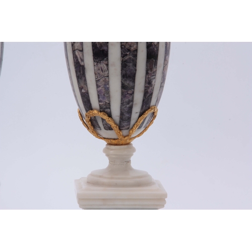 590 - A PAIR OF WHITE MARBLE AND BLUE JOHN TYPE CRYSTAL INLAID URNS with ormolu finials and swag decoratio... 