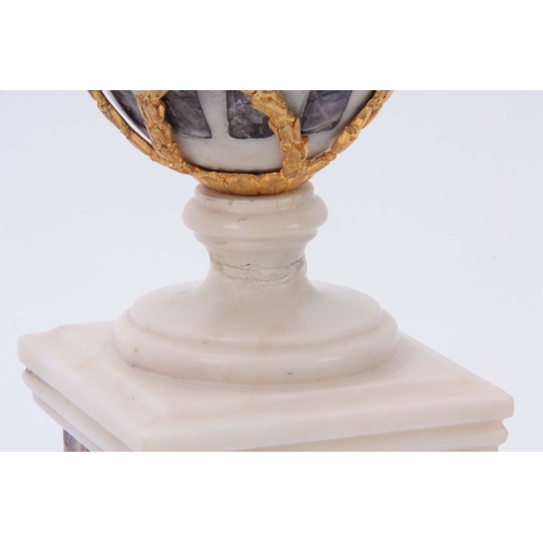 590 - A PAIR OF WHITE MARBLE AND BLUE JOHN TYPE CRYSTAL INLAID URNS with ormolu finials and swag decoratio... 