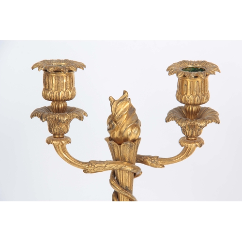 593 - A PAIR OF 19TH CENTURY FRENCH ORMOLU TWO BRANCH CANDELABRA on circular ornate cast bases with flambe... 