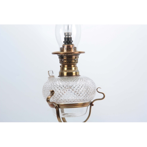 596 - AN ART NOUVEAU BRASS AND CUT GLASS OIL LAMP having unusual hobnail cut vessel with refill plug mount... 